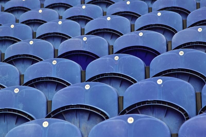 Rows of blue stadium seats