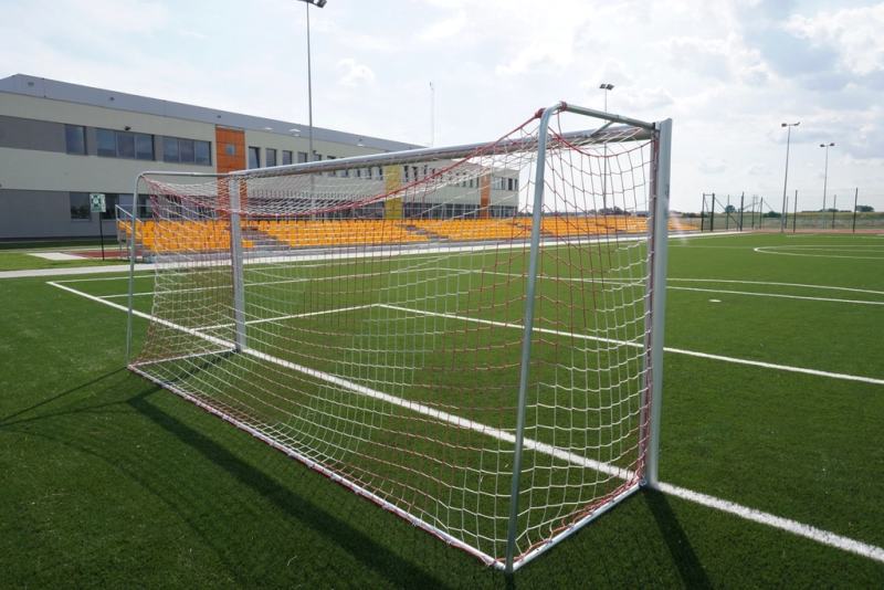 Football goal and net on a stadium pitch