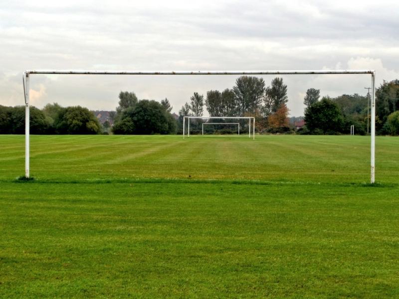 Two goals on a grass football pitch