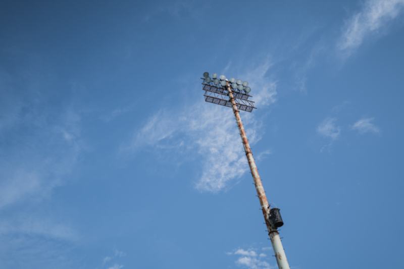 Stadium floodlight against a blue sky