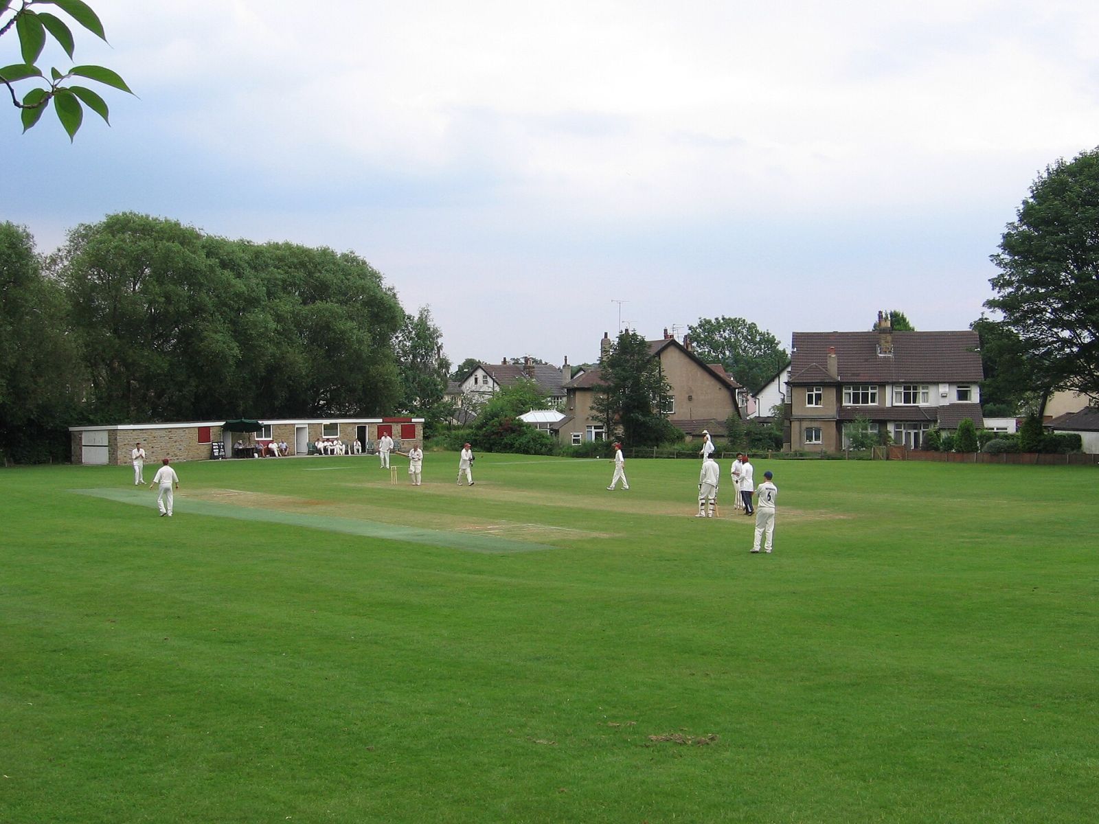 Club cricket on a village green