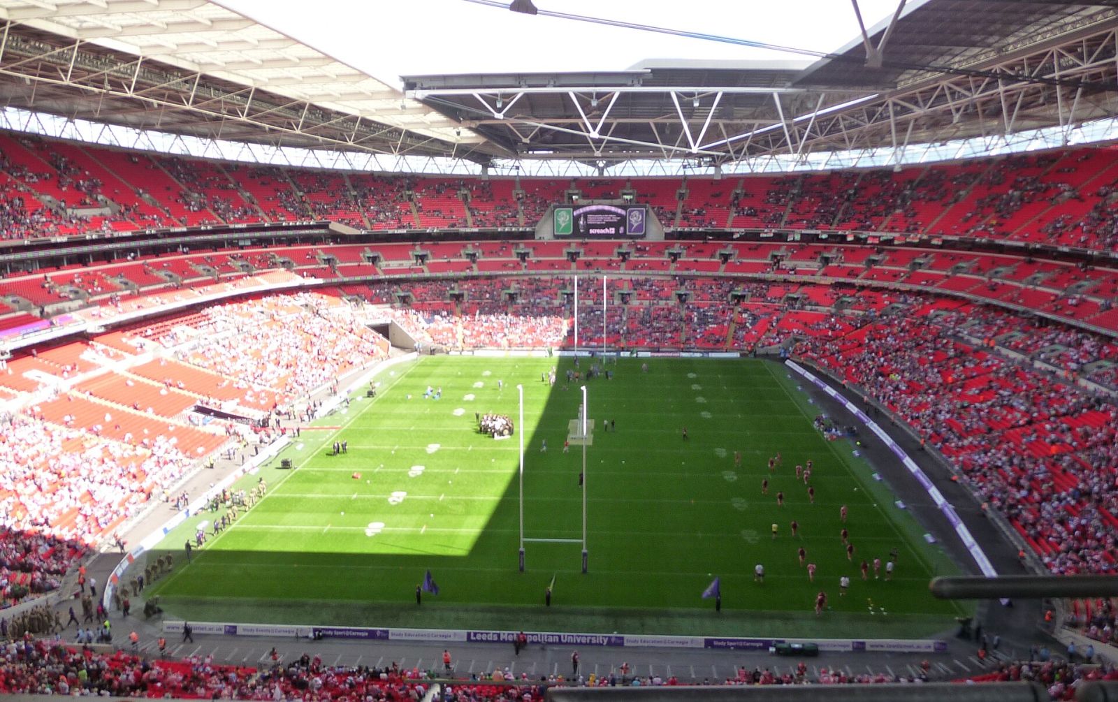 Wembley Stadium bowl packed with fans on a match day